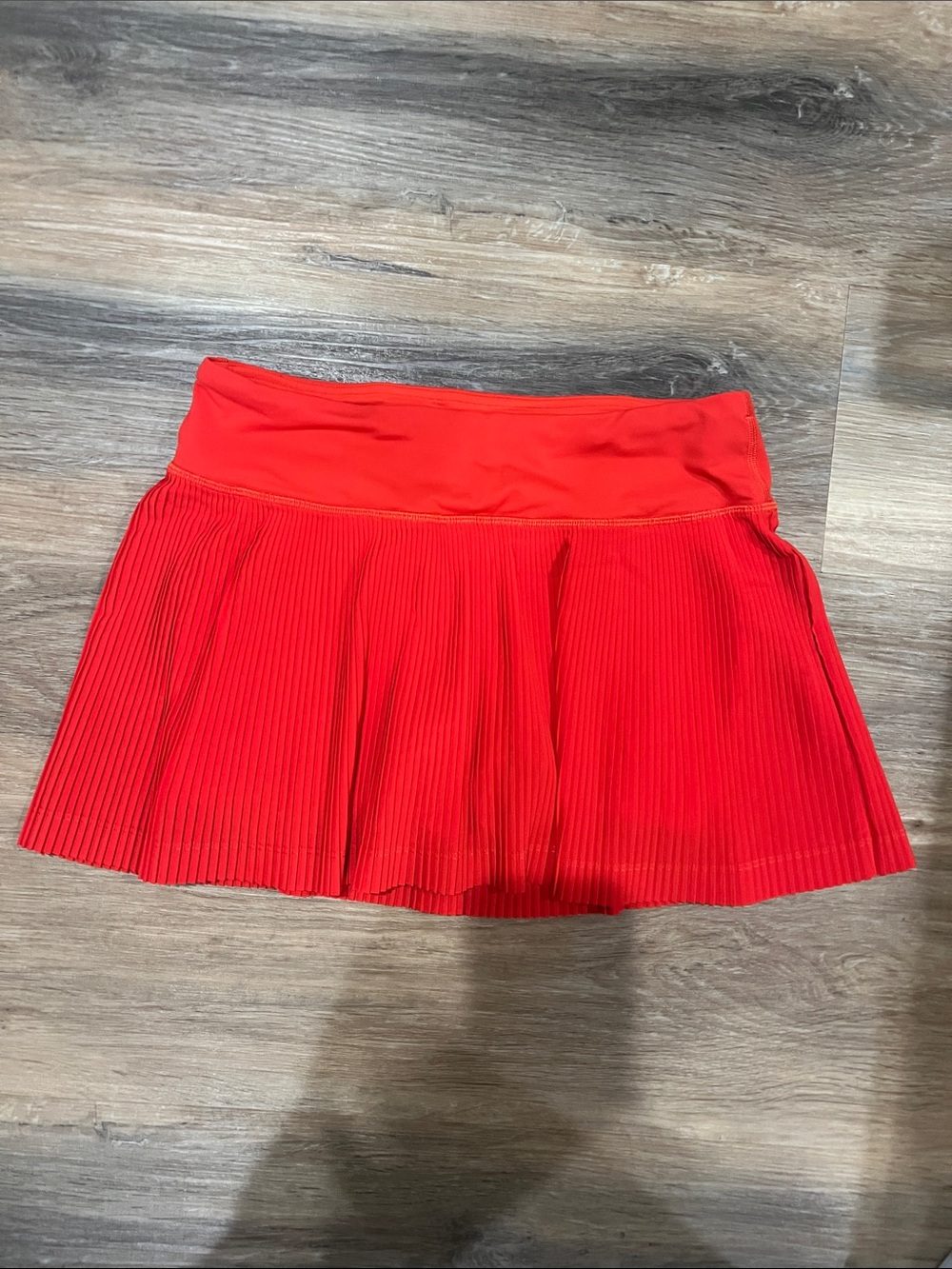 Women's red/orange tennis skirt size 4